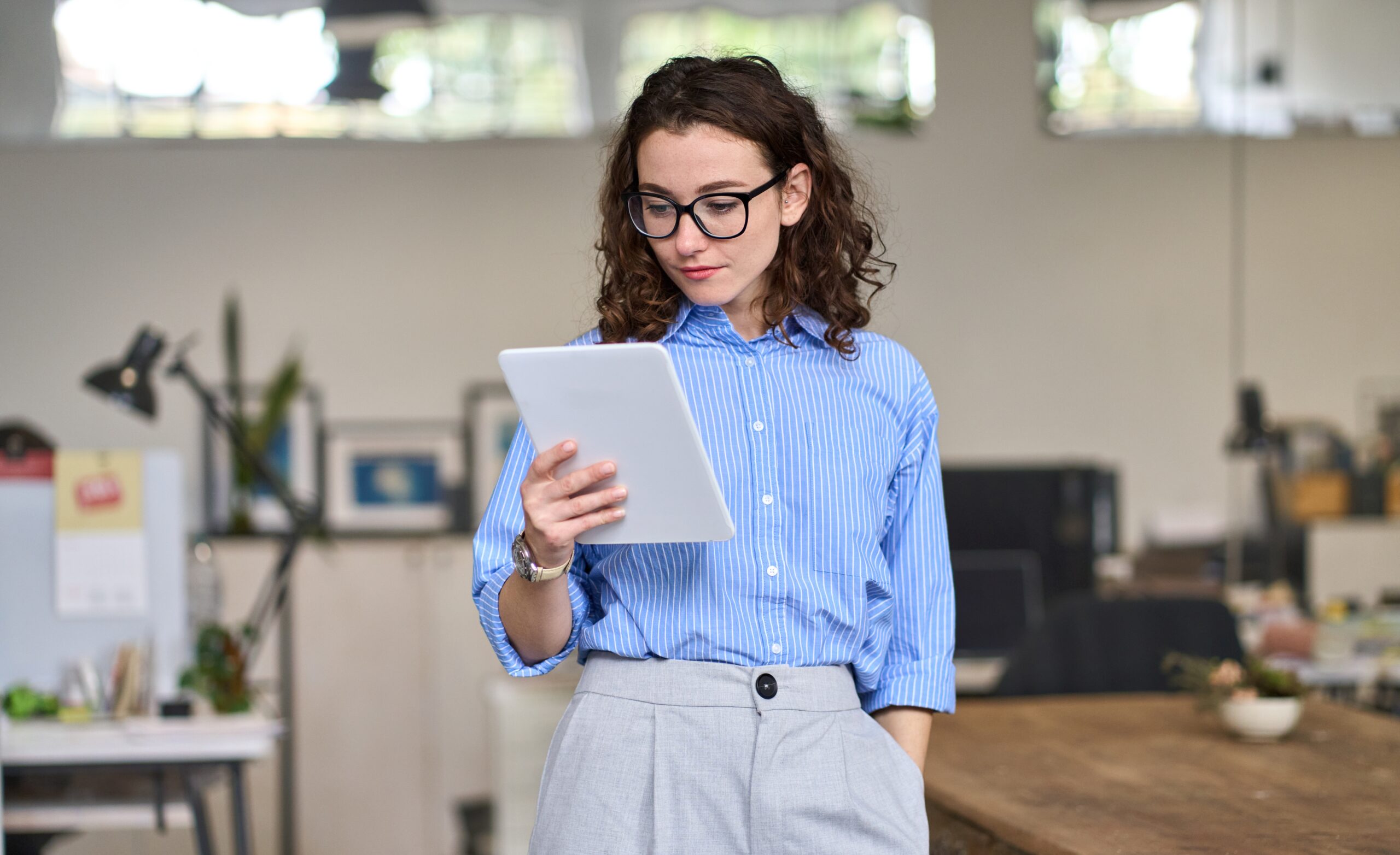 woman holding a tablet for marketing job